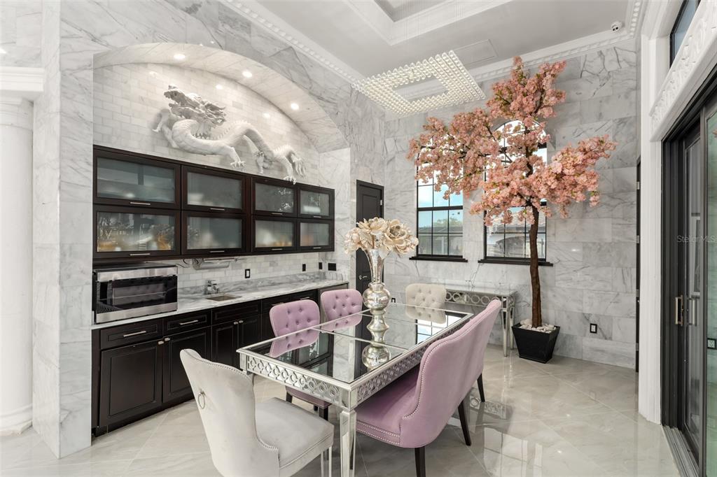 9639 Westover Roberts Road Windermere, FL 34786 - Photo 34 of 65 a kitchen with a table and chairs in it