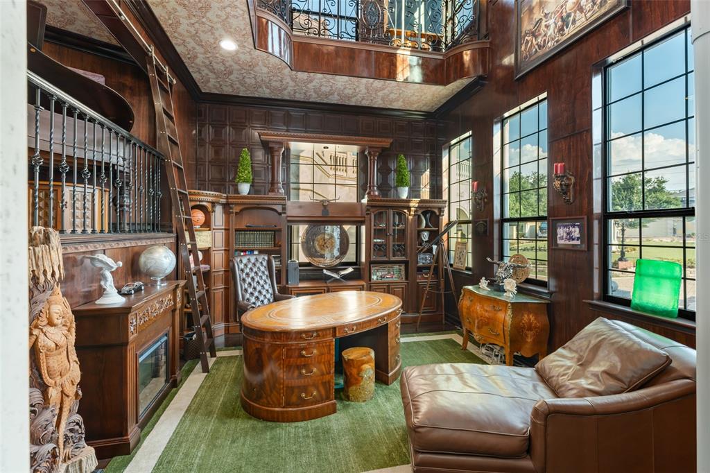 9639 Westover Roberts Road Windermere, FL 34786 - Photo 38 of 65 a room with furniture and a chandelier