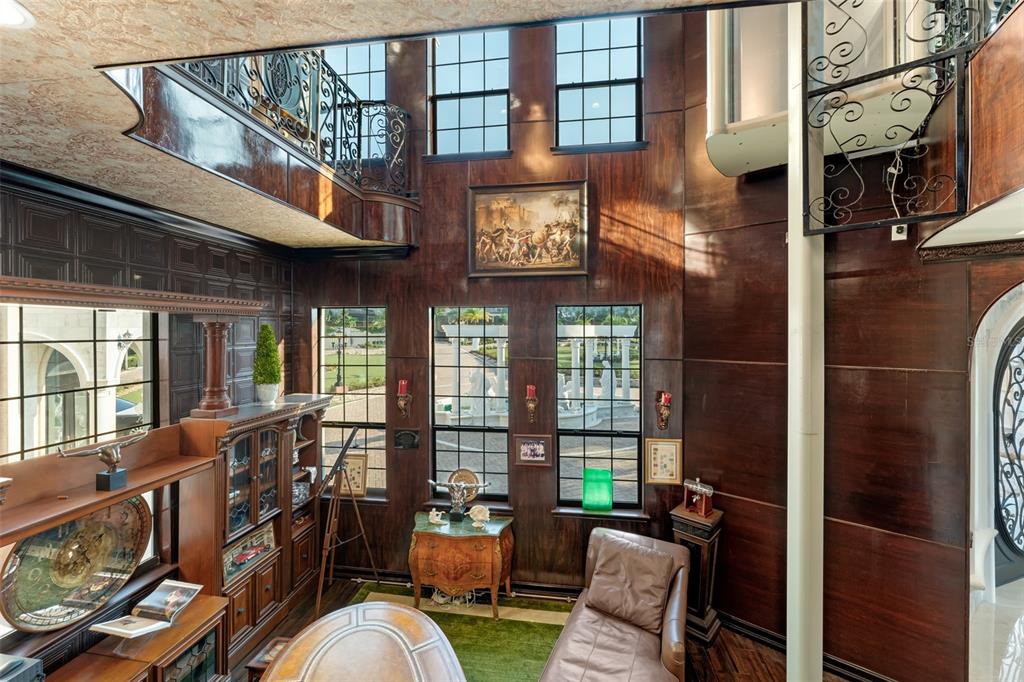 9639 Westover Roberts Road Windermere, FL 34786 - Photo 46 of 78 a view of a patio with couches chairs and wooden floor