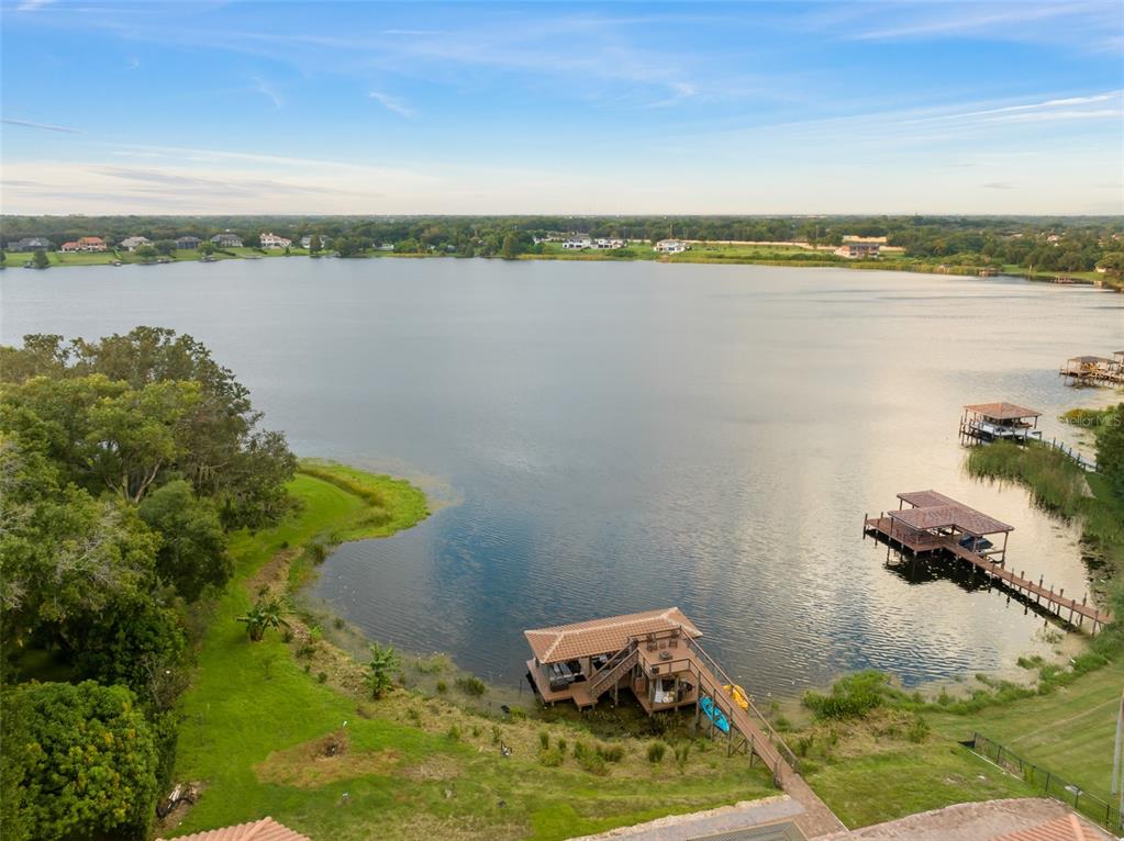 9639 Westover Roberts Road Windermere, FL 34786 - Photo 5 of 65 a view of a lake with a mountain
