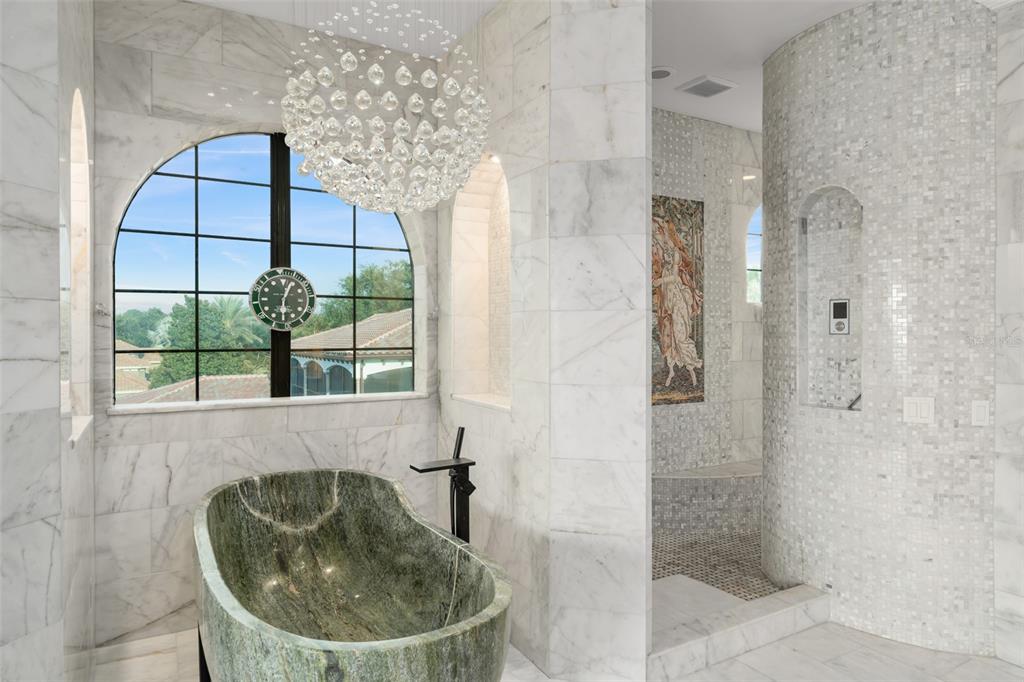 9639 Westover Roberts Road Windermere, FL 34786 - Photo 51 of 65 a bathroom with a sink and shower