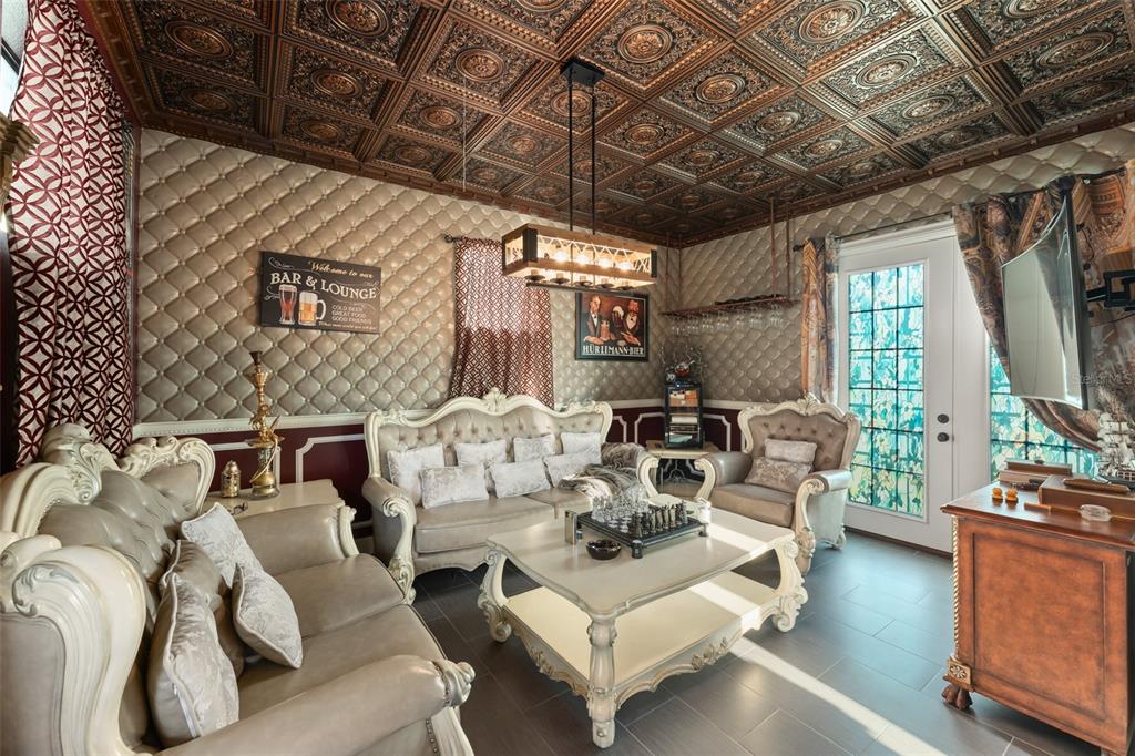 9639 Westover Roberts Road Windermere, FL 34786 - Photo 57 of 65 a living room with furniture and a large window