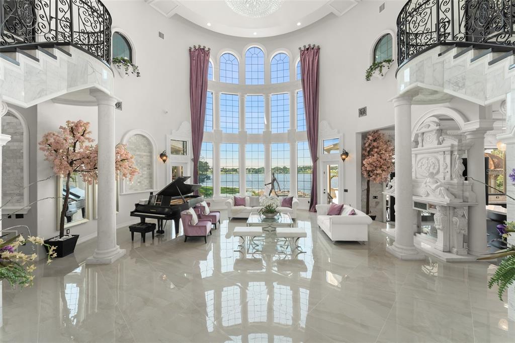 9639 Westover Roberts Road Windermere, FL 34786 - Photo 7 of 65 a living room with fireplace furniture and a large window