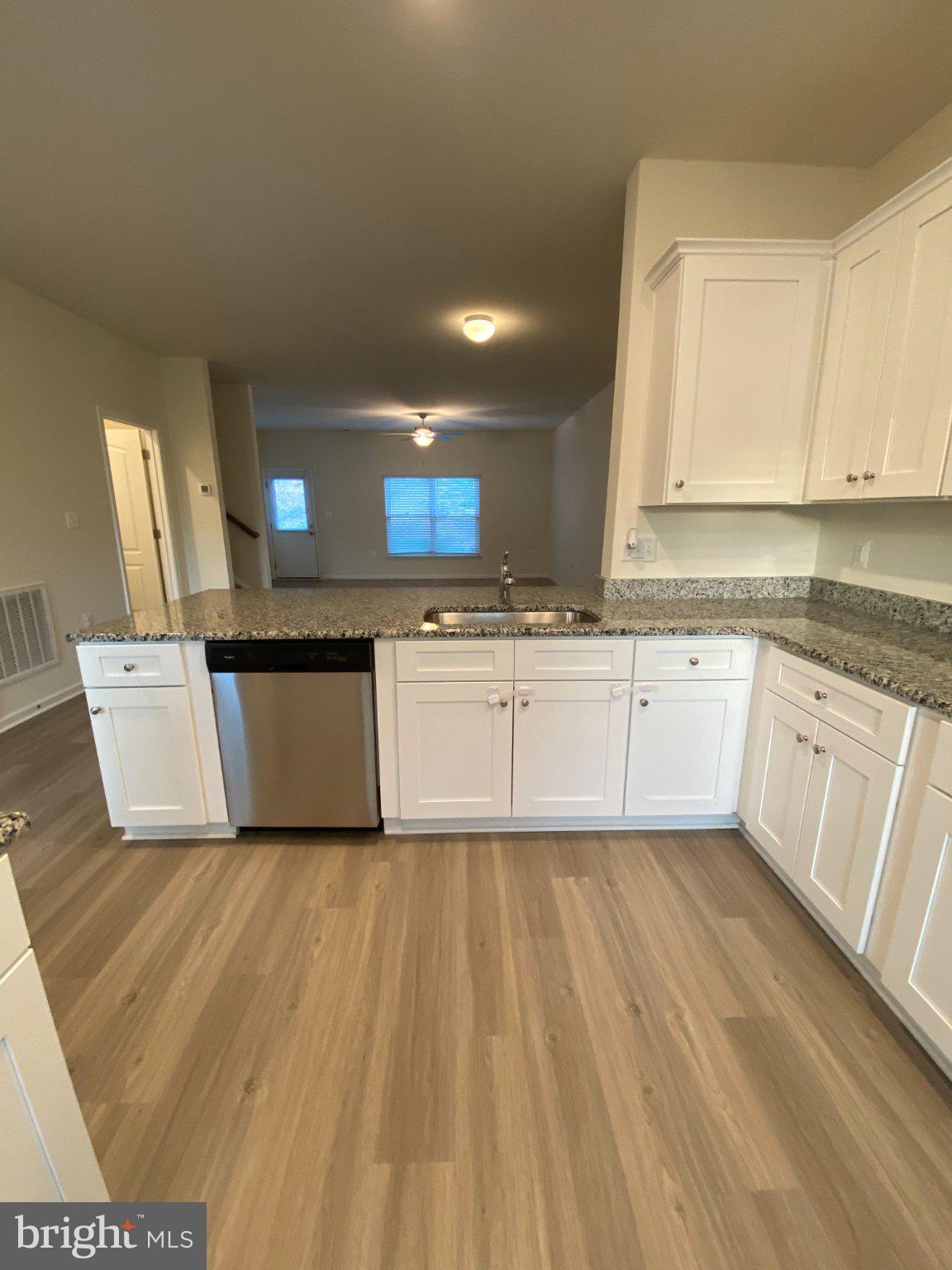 697 Rivanna Run Falling Waters, WV 25419 - Photo 7 of 44 a view of a kitchen with sink and cabinets