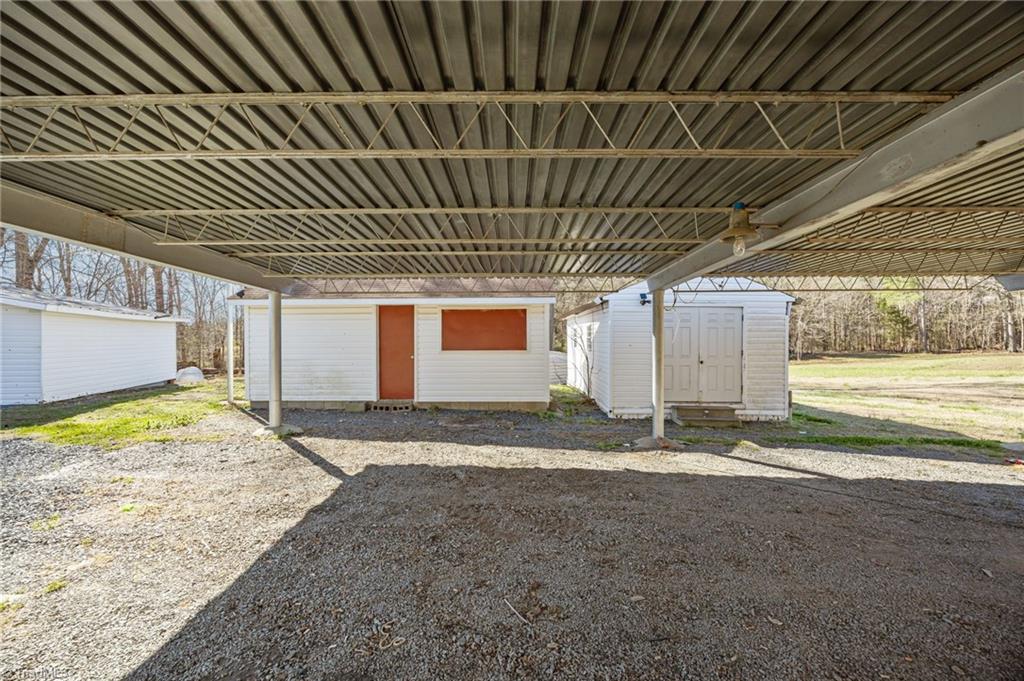 4027 Old Lexington Road Asheboro, NC 27205 - Photo 34 of 44 Underneath rear carport, looking at storage building