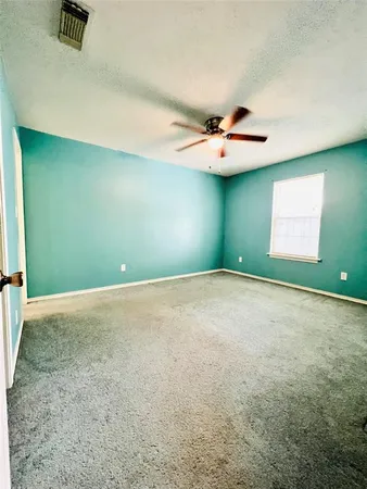 an empty room with a empty space and a window