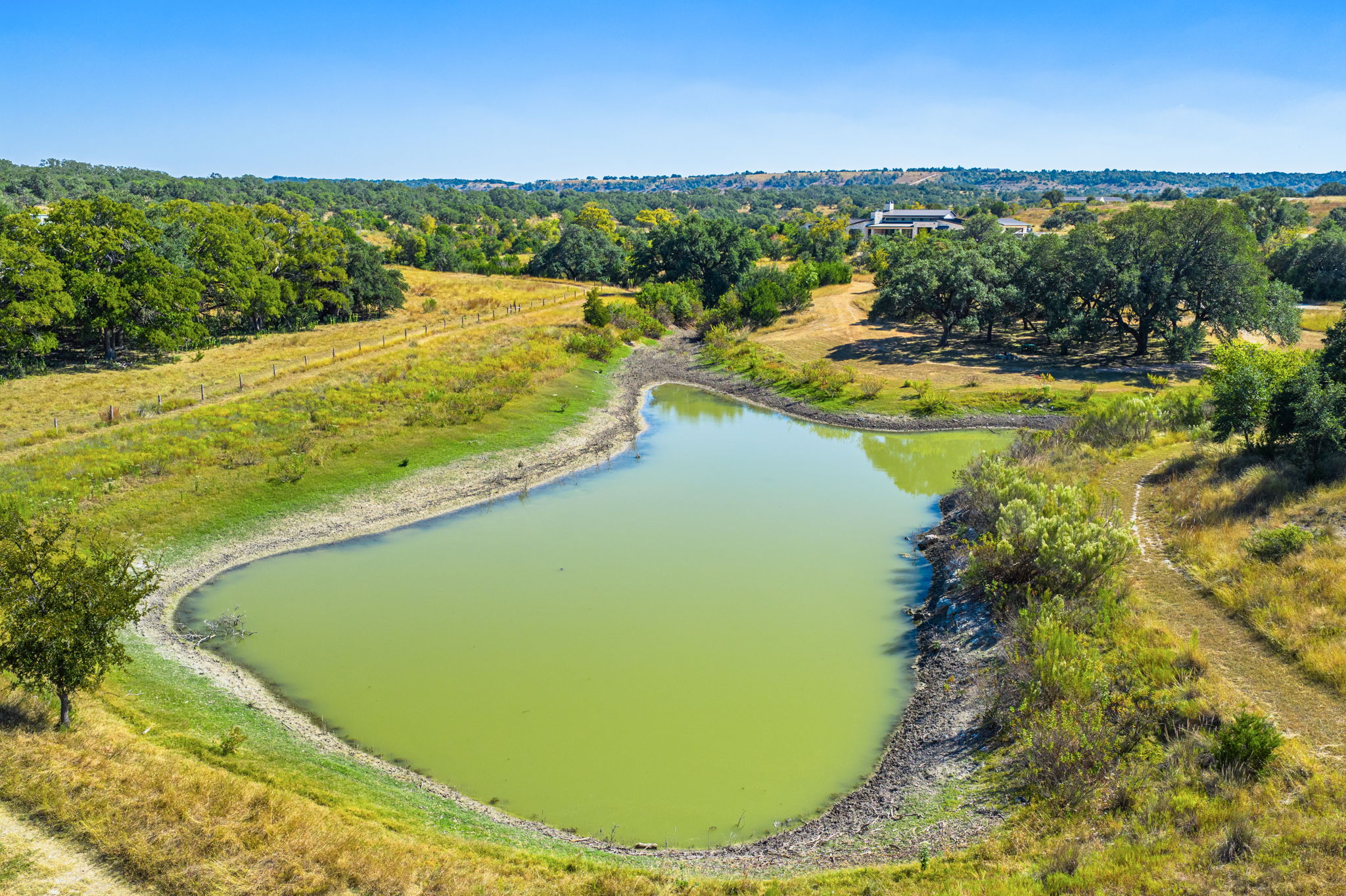 1495 Walnut Springs Road Johnson City, TX 78636 - Photo 14 of 23 a view of a swimming pool and lake view