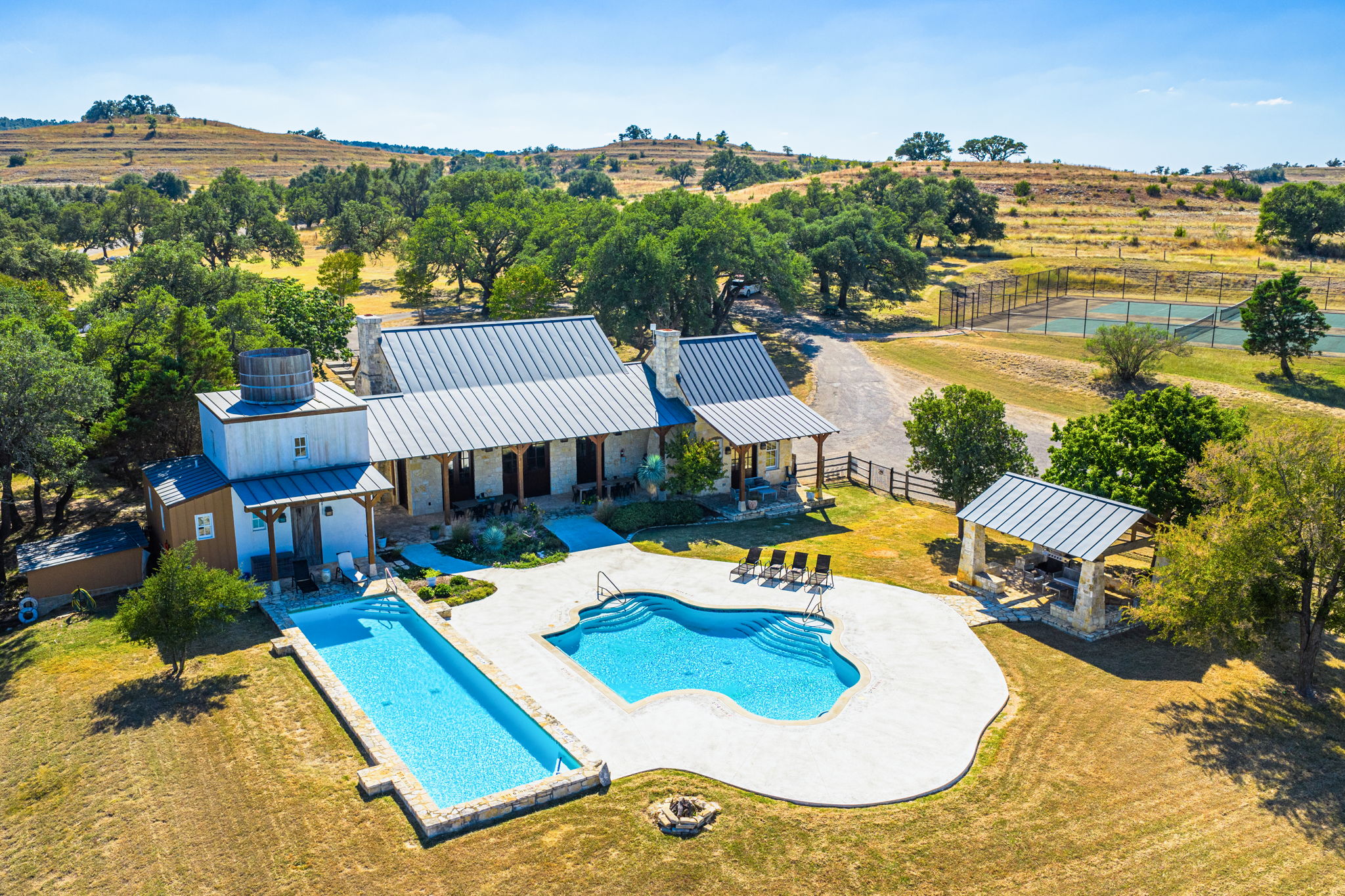 1495 Walnut Springs Road Johnson City, TX 78636 - Photo 17 of 23 an aerial view of a house with yard swimming pool and outdoor seating
