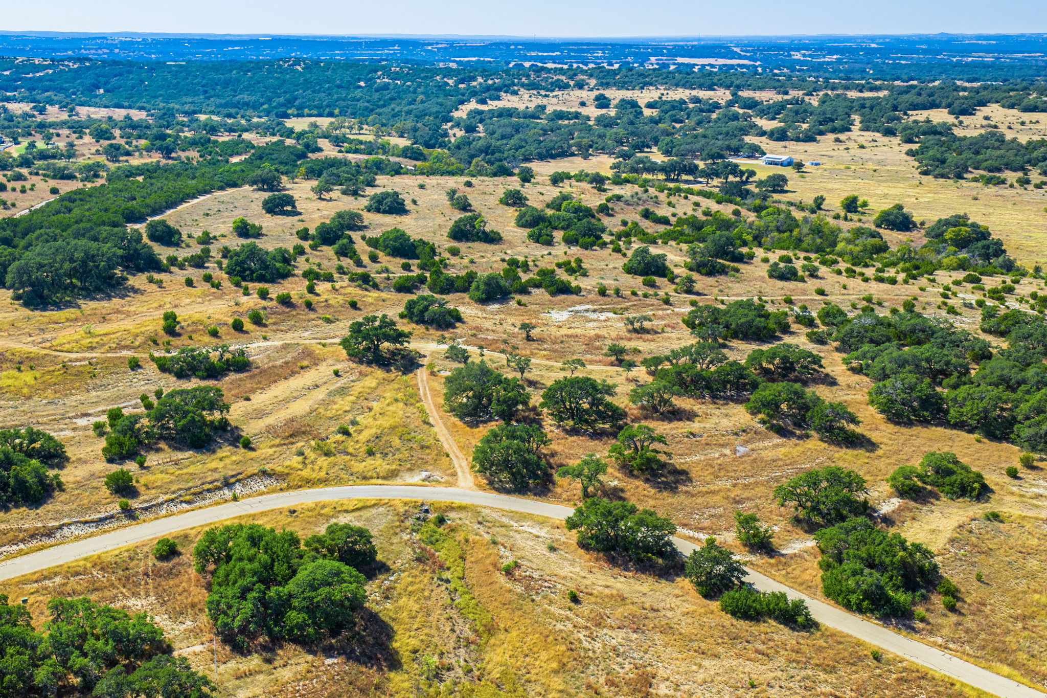 1495 Walnut Springs Road Johnson City, TX 78636 - Photo 2 of 23 an aerial view of residential houses with outdoor space