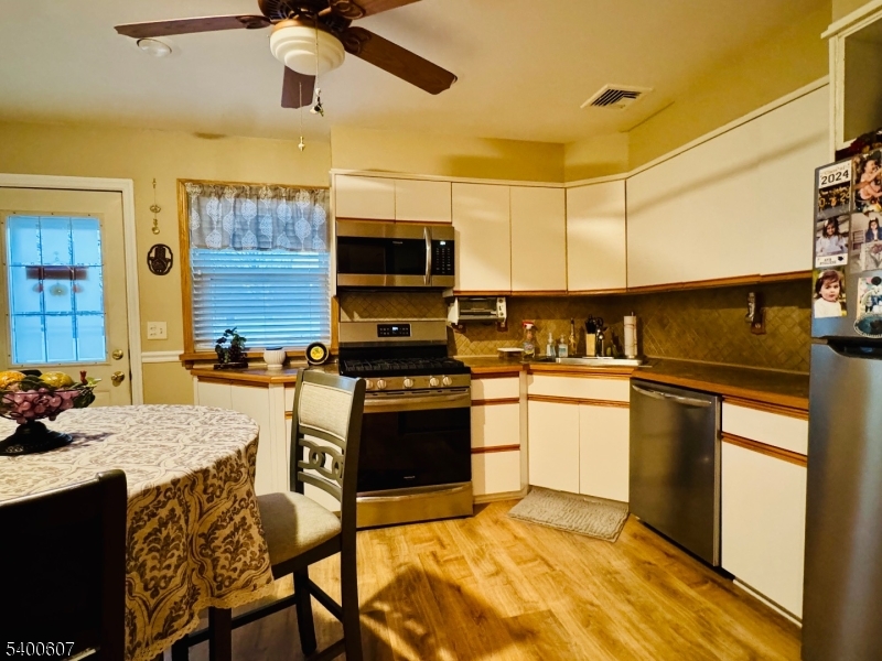 559 South Springfield Avenue Springfield, NJ 07081 - Photo 12 of 20 a kitchen with a sink cabinets and stainless steel appliances