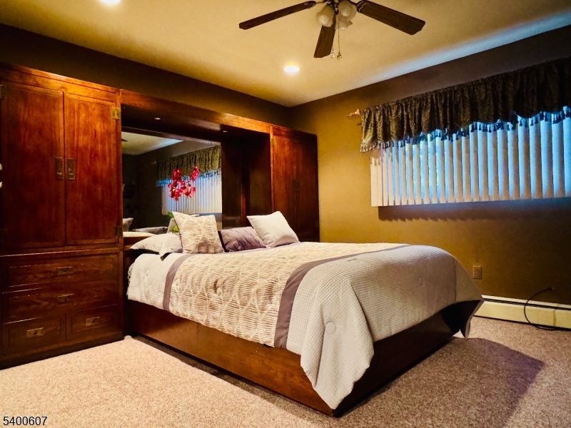 559 South Springfield Avenue Springfield, NJ 07081 - Photo 16 of 20 a bedroom with bed and wooden floor