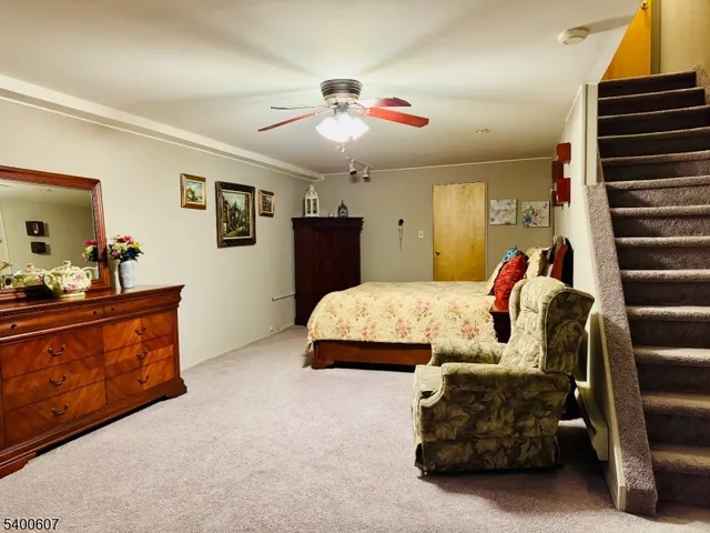 a spacious bedroom with a bed and furniture