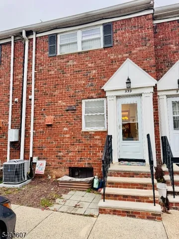 a view of street with parked cars
