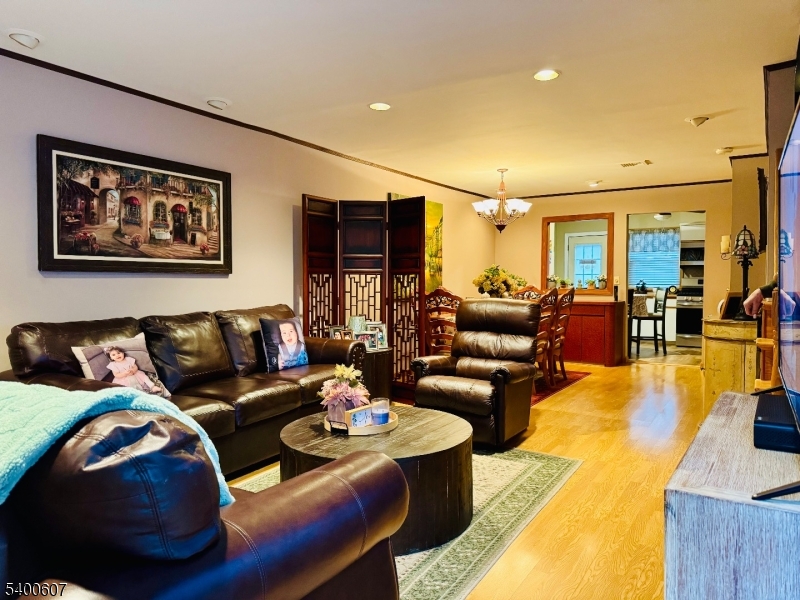 559 South Springfield Avenue Springfield, NJ 07081 - Photo 5 of 20 a living room with furniture and a large window
