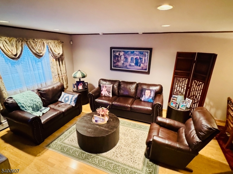 559 South Springfield Avenue Springfield, NJ 07081 - Photo 7 of 20 a living room with furniture and a wooden floor