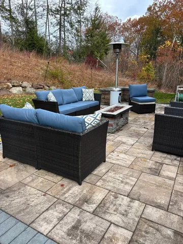 a view of a dining room with furniture and window