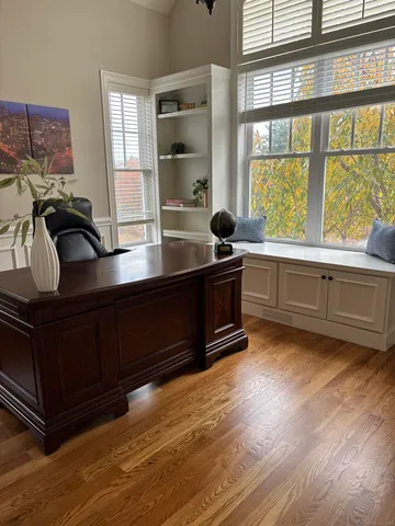a kitchen with stainless steel appliances granite countertop a stove and a wooden floors