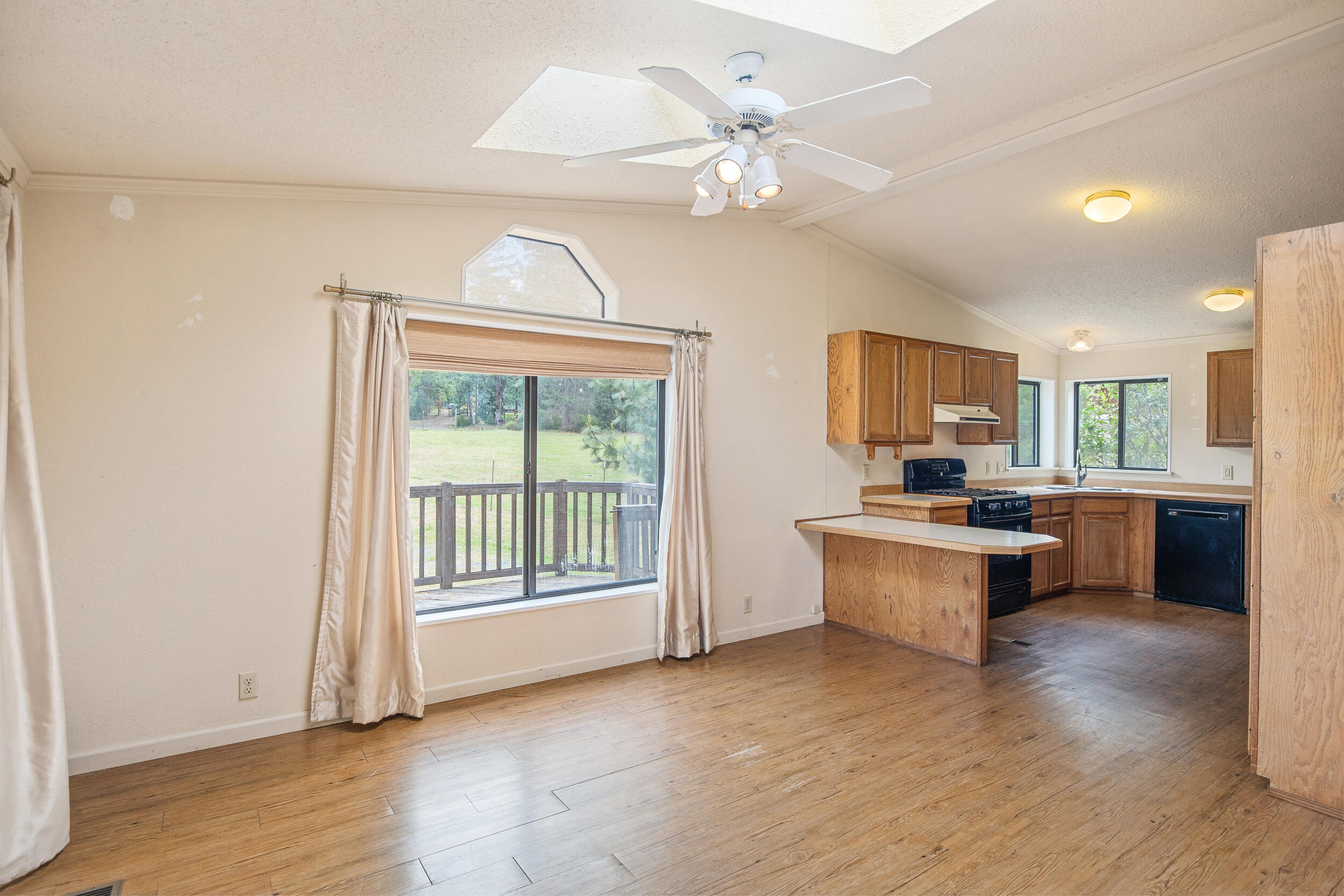 2720 Hugo Road Merlin, OR 97532 - Photo 12 of 38 Dining room and kitchen op to the great room with sliding glass door to the front patio