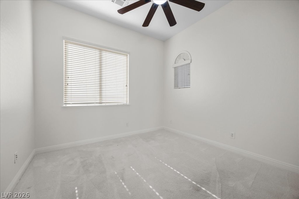 2125 De Rouge Avenue Henderson, NV 89044 - Photo 58 of 96 Sun-filled room with ceiling fan offers ample light and comfort.