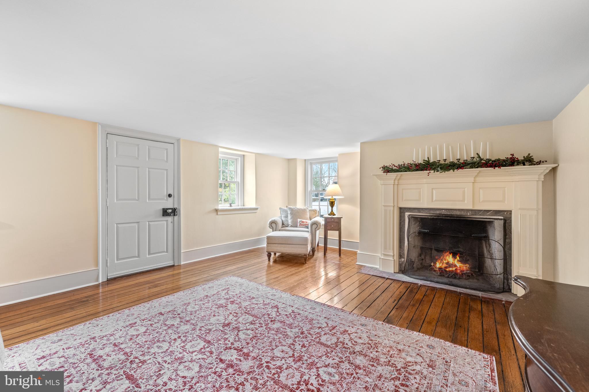 1936 Lenape Road West Chester, PA 19382 - Photo 19 of 72 a living room with furniture and a fireplace