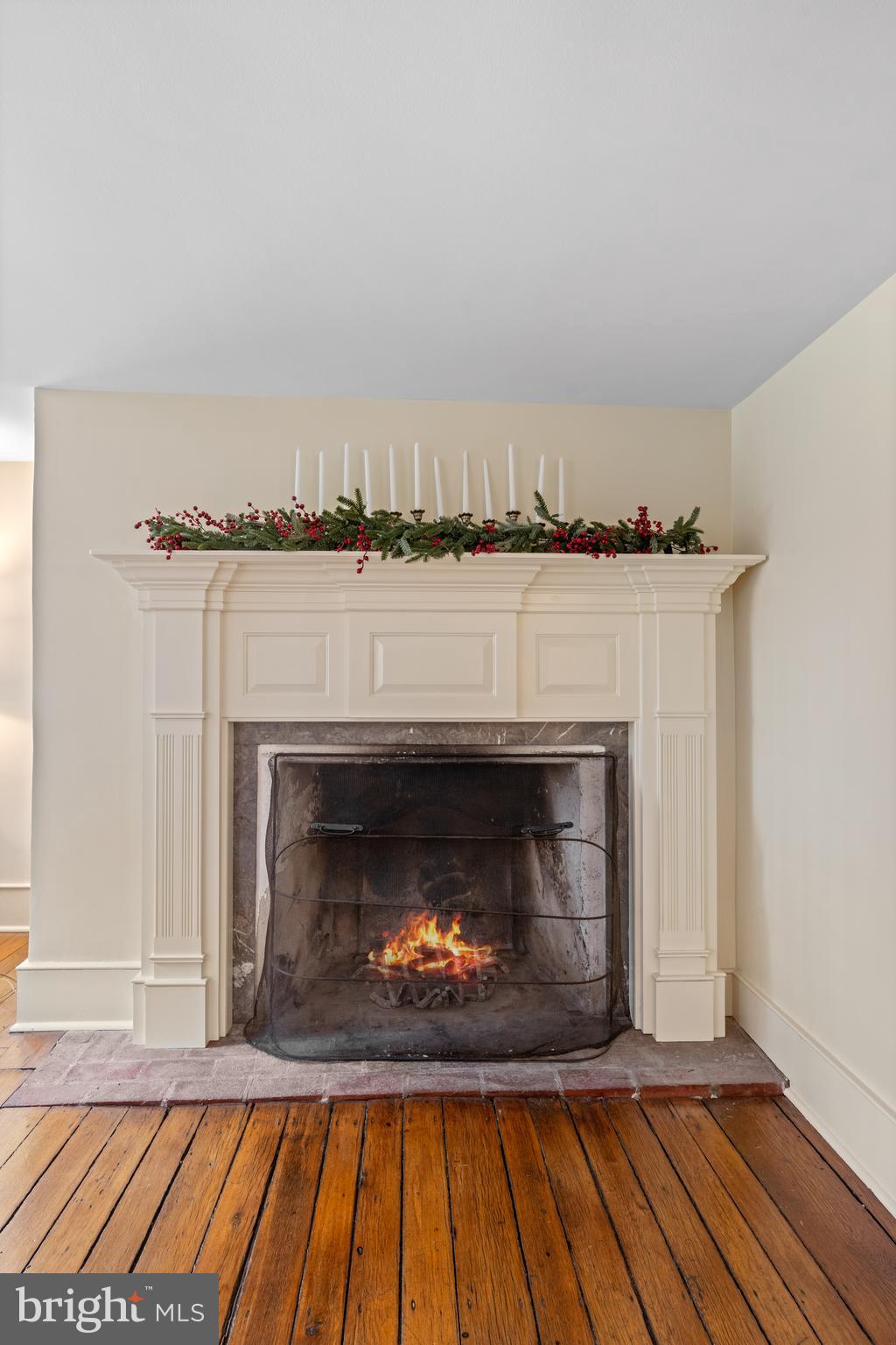 1936 Lenape Road West Chester, PA 19382 - Photo 21 of 72 a living room with a fireplace and a wooden floor