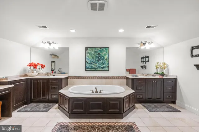 a bedroom with a bed and a fireplace