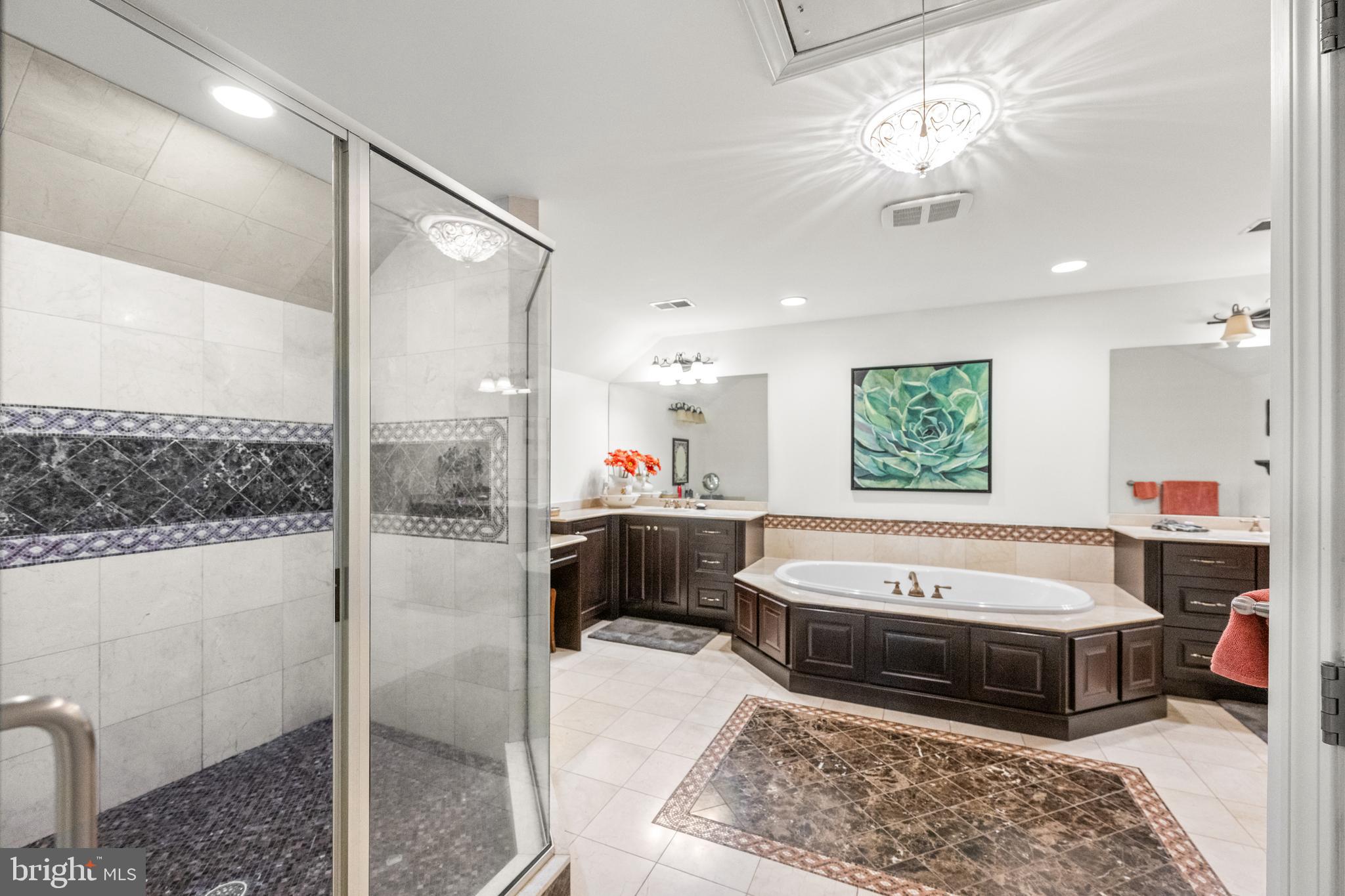 1936 Lenape Road West Chester, PA 19382 - Photo 35 of 72 a bathroom with a tub a sink and a mirror