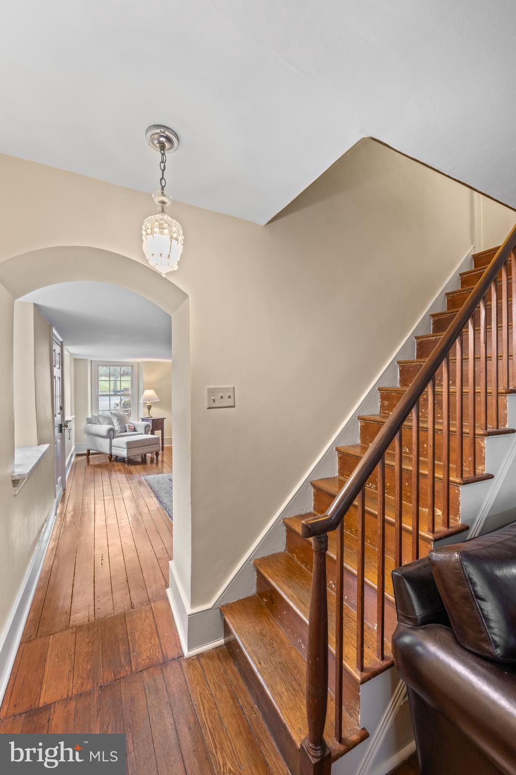 1936 Lenape Road West Chester, PA 19382 - Photo 40 of 72 a view of a hallway with wooden floor and staircase