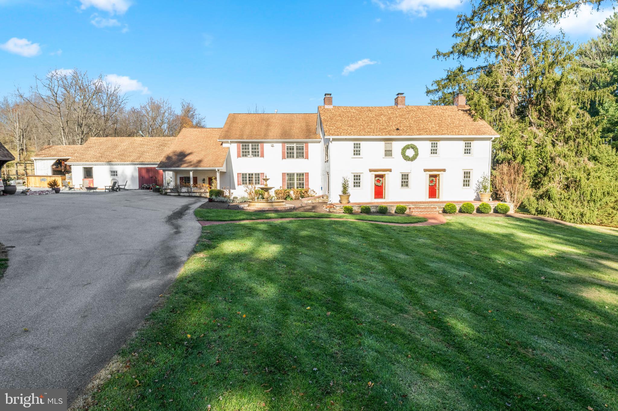 1936 Lenape Road West Chester, PA 19382 - Photo 4 of 72 a view of a white house next to a big yard and large trees