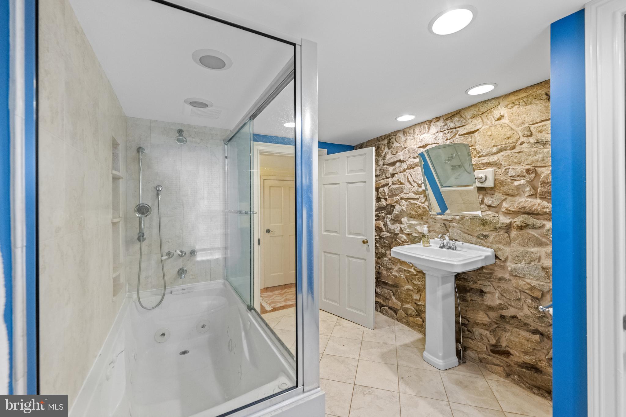 1936 Lenape Road West Chester, PA 19382 - Photo 42 of 72 a bathroom with a shower and mirror