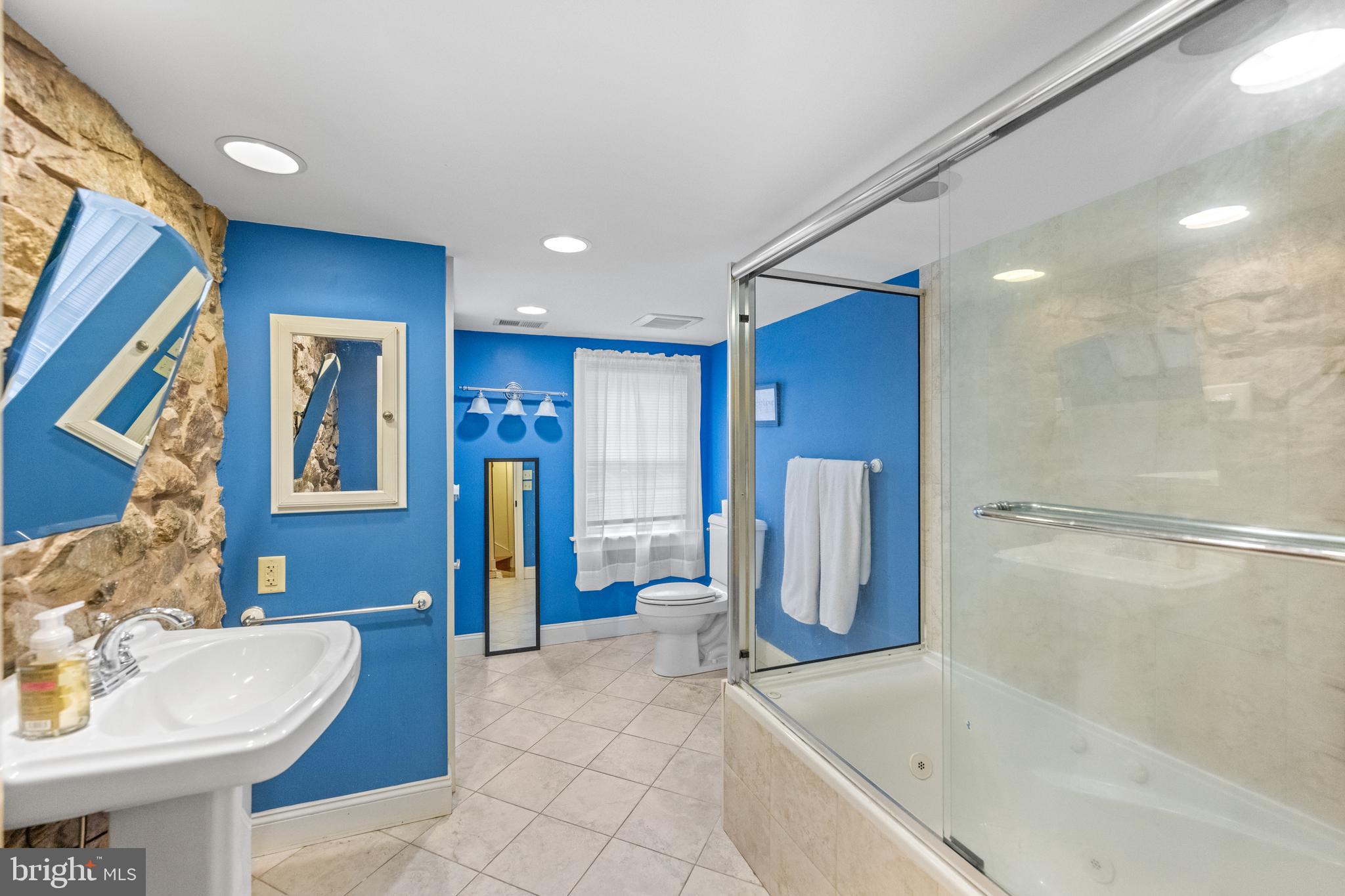 1936 Lenape Road West Chester, PA 19382 - Photo 43 of 72 a bathroom with a tub sink and mirror