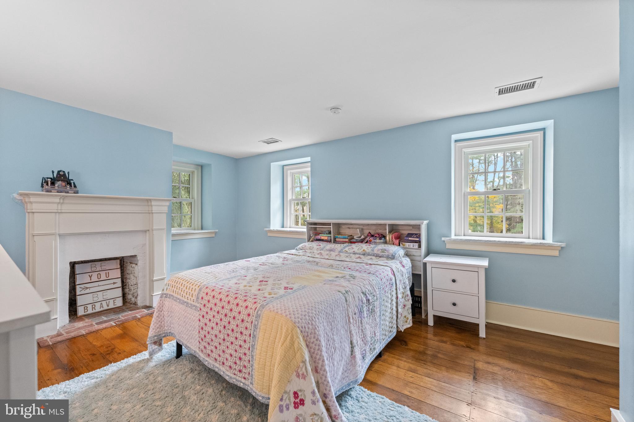 1936 Lenape Road West Chester, PA 19382 - Photo 45 of 72 a bedroom with a bed and a fireplace
