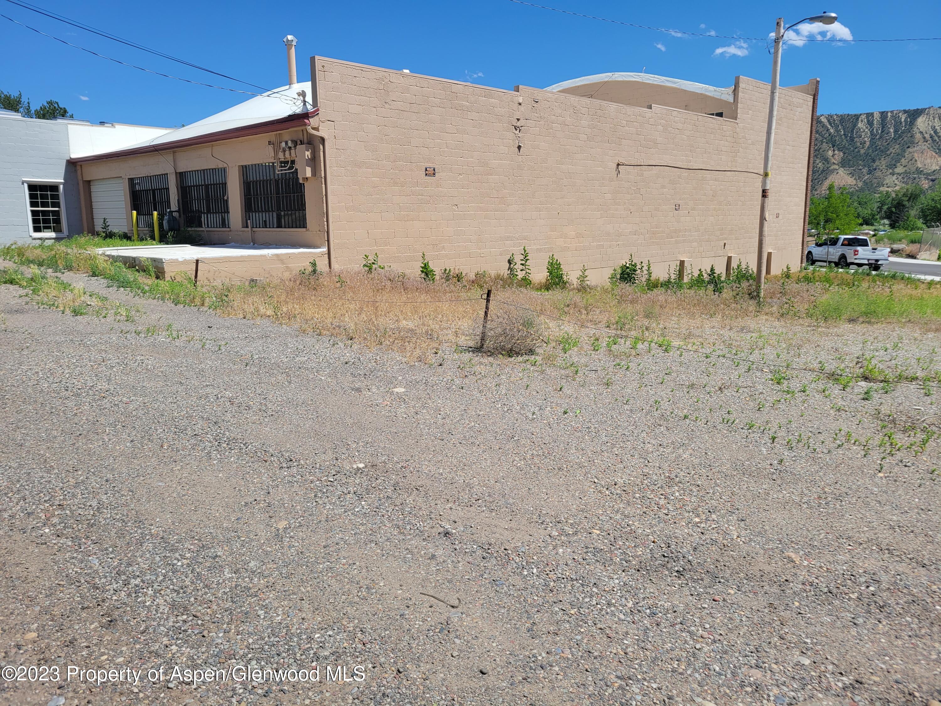 130 West 2nd Street, Unit 2 Rifle, CO 81650 - Photo 13 of 17 a view of a house with a backyard