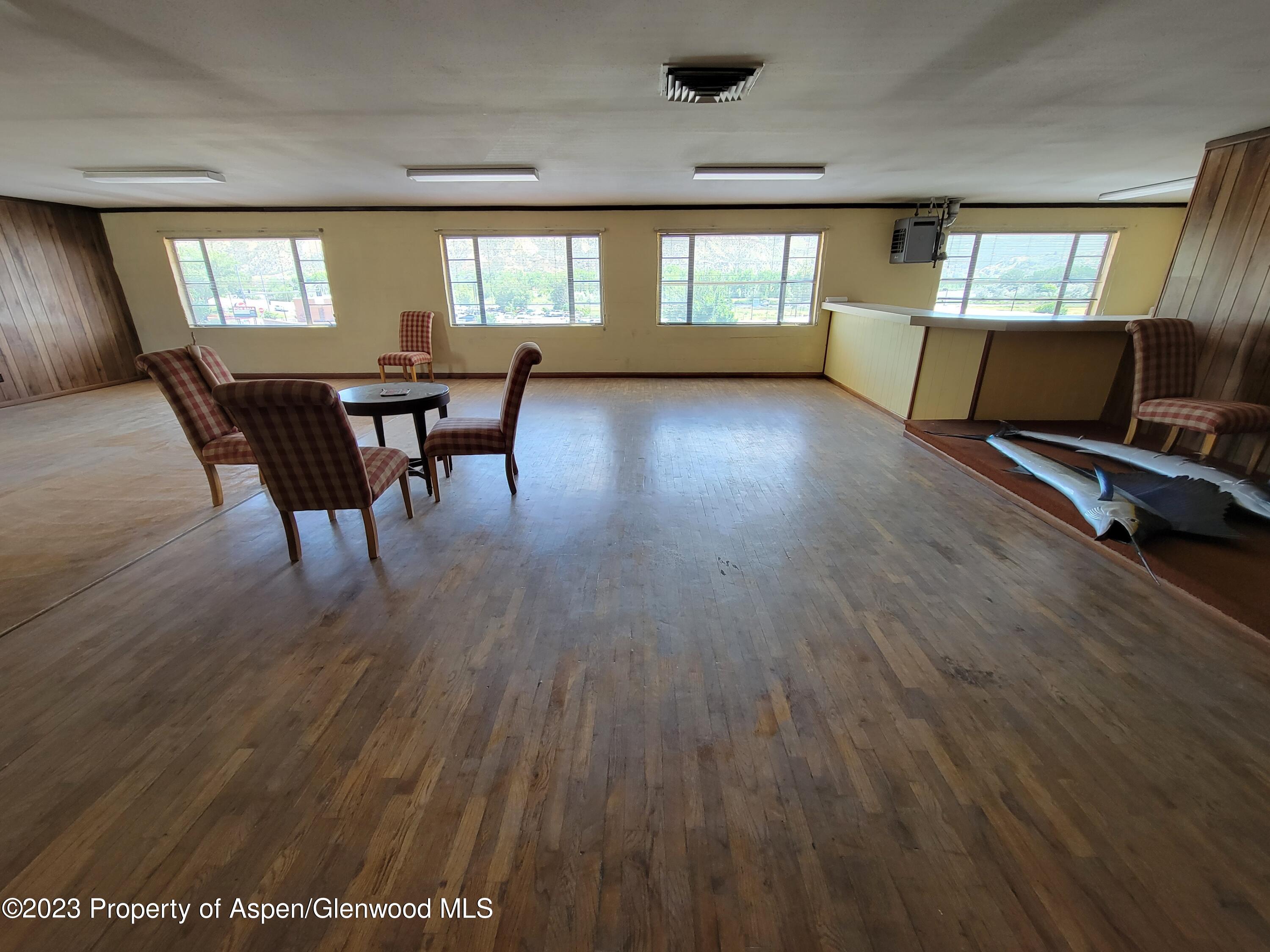 130 West 2nd Street, Unit 2 Rifle, CO 81650 - Photo 5 of 17 a view of a livingroom with furniture window and wooden floor