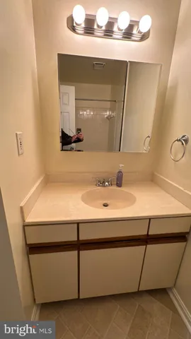 a bathroom with a shower and a bath tub