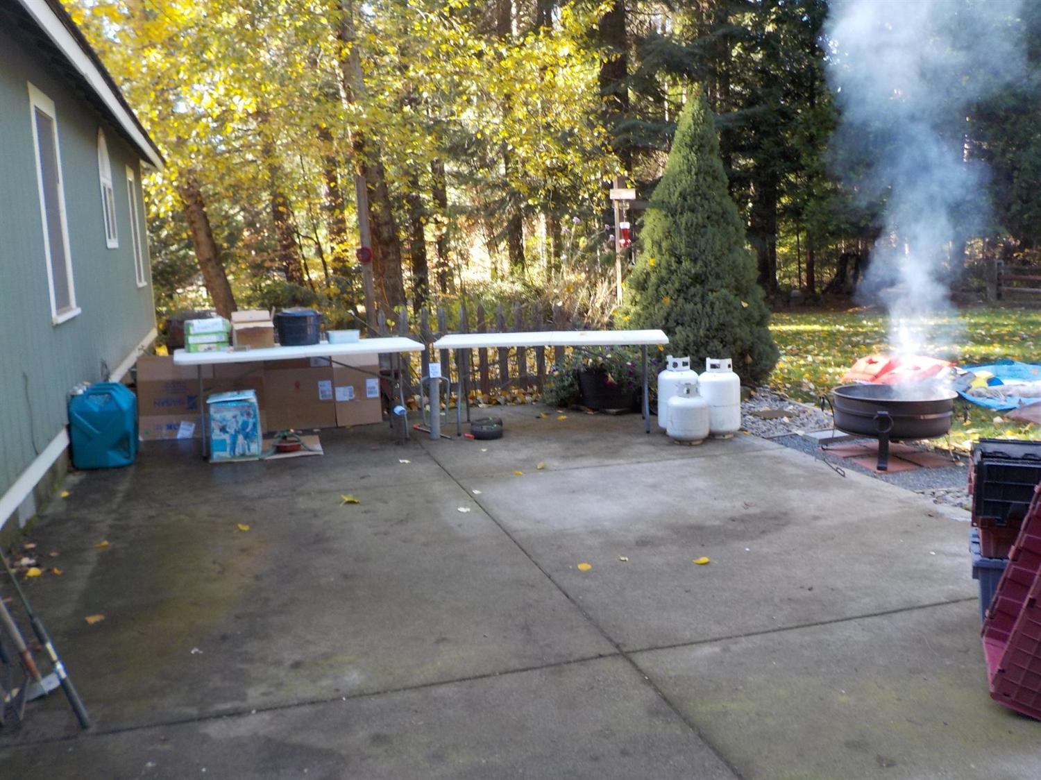 341 Red Blanket Road Prospect, OR 97536 - Photo 3 of 19 Large patio in back of the home with a f