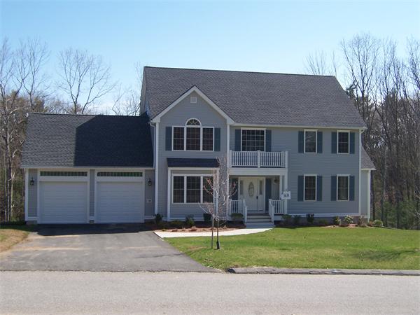 131 Robin Hill Road Groton, MA 01450 - Photo 1 of 22 a front view of a house with a yard and garage