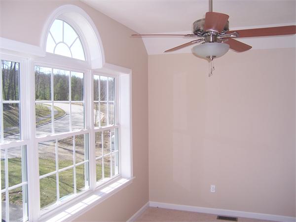 131 Robin Hill Road Groton, MA 01450 - Photo 15 of 22 a view of a livingroom with a fan