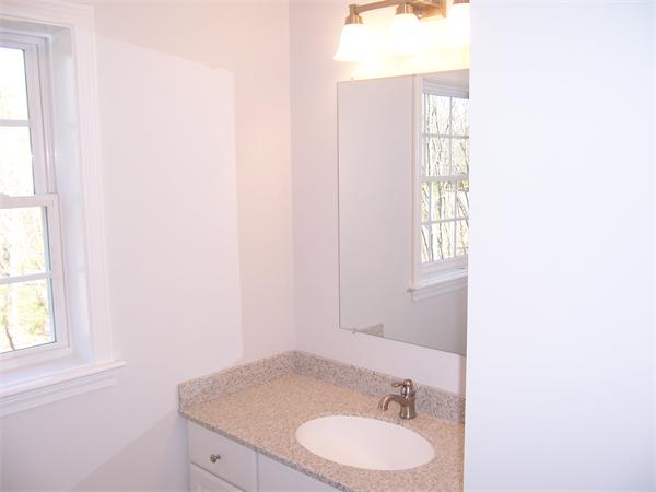 131 Robin Hill Road Groton, MA 01450 - Photo 16 of 22 a bathroom with a granite countertop sink and a mirror