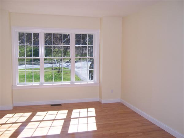 131 Robin Hill Road Groton, MA 01450 - Photo 5 of 22 a view of an empty room with a window
