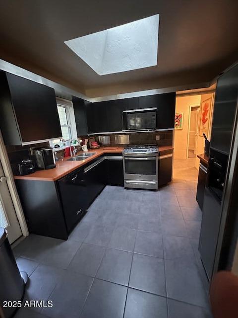 22 East 15th Street Tempe, AZ 85281 - Photo 36 of 84 a kitchen with a large counter top space appliances and cabinets