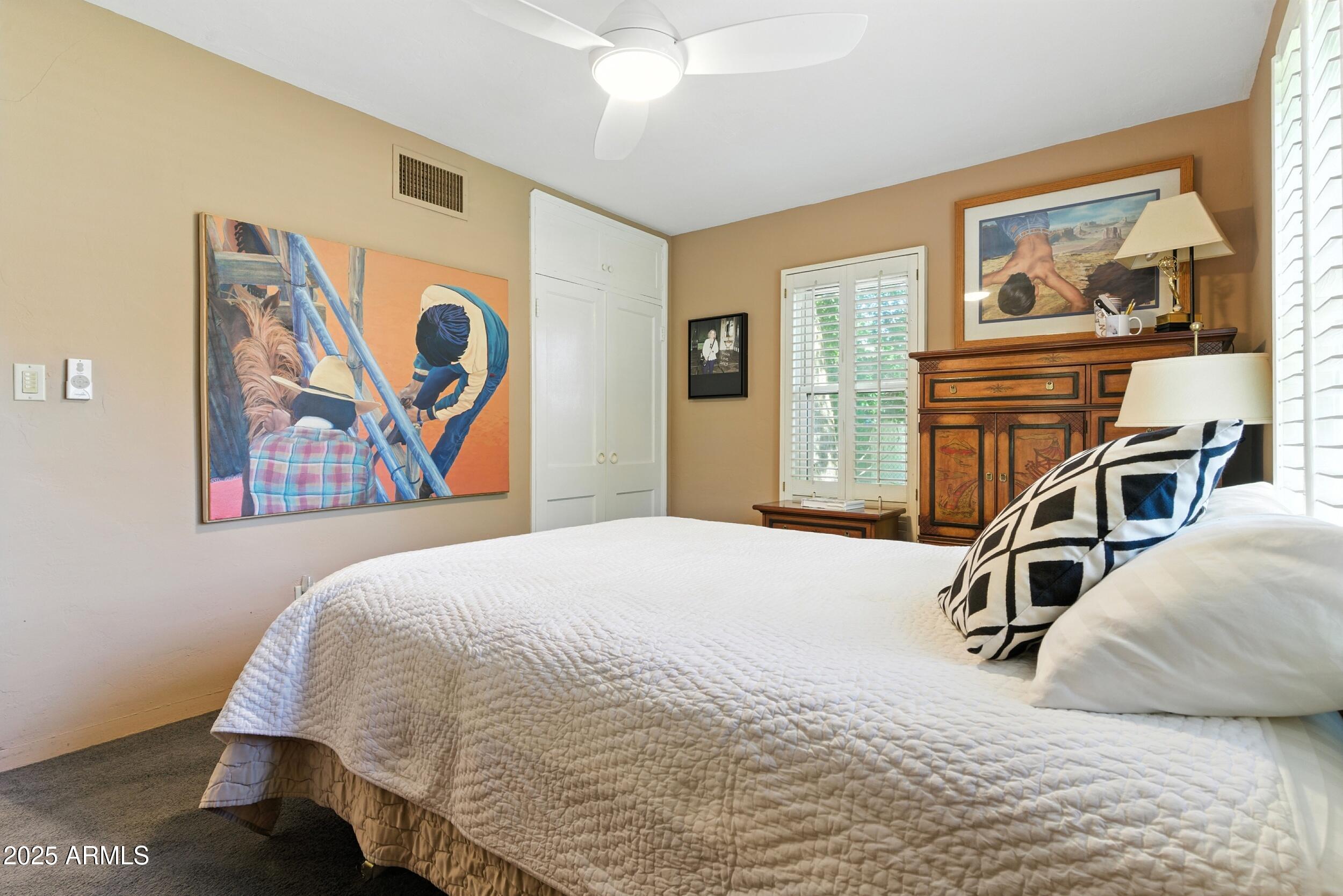 22 East 15th Street Tempe, AZ 85281 - Photo 48 of 84 a bedroom with a bed and wooden floor