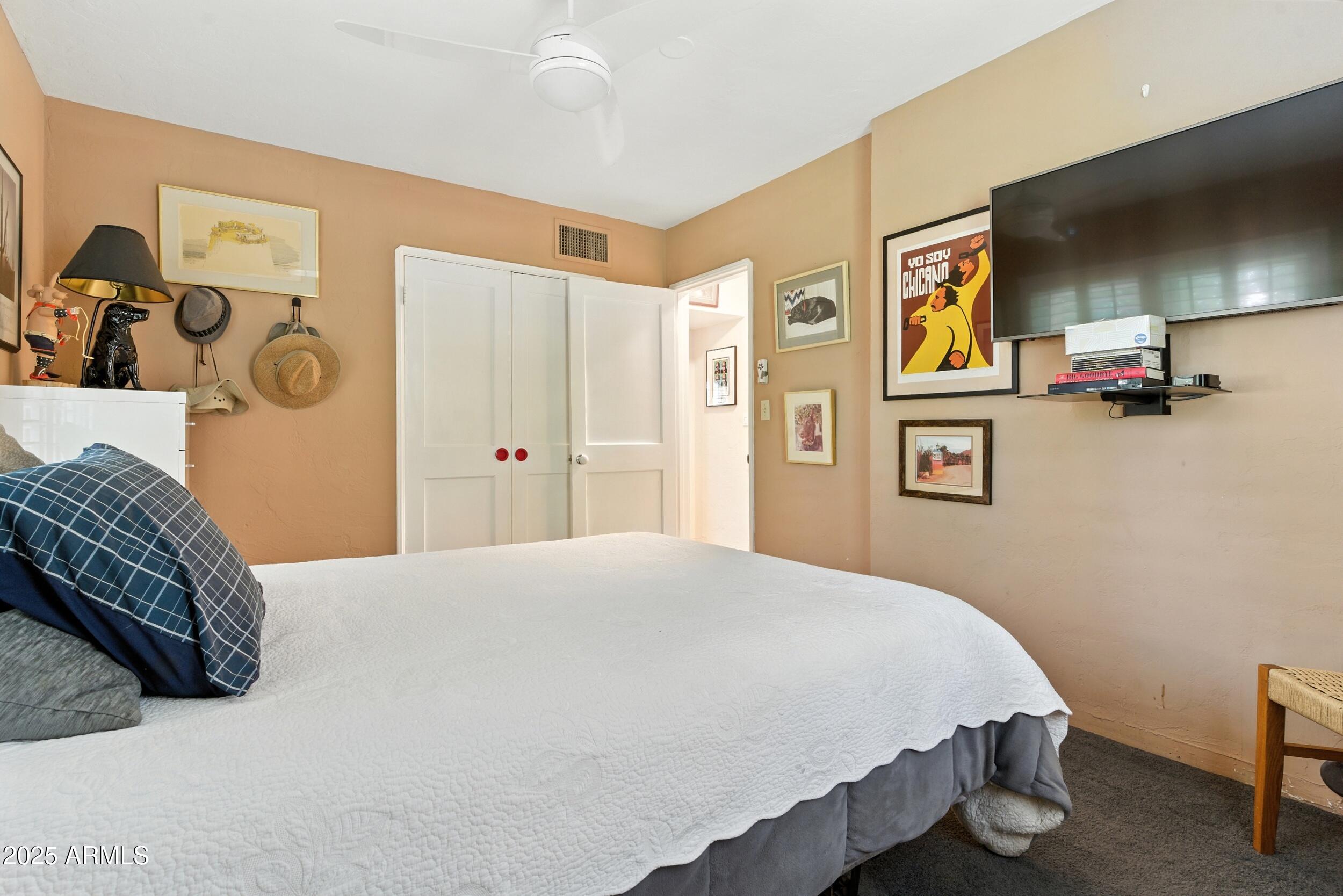 22 East 15th Street Tempe, AZ 85281 - Photo 50 of 84 a bedroom with a bed and painting on the wall