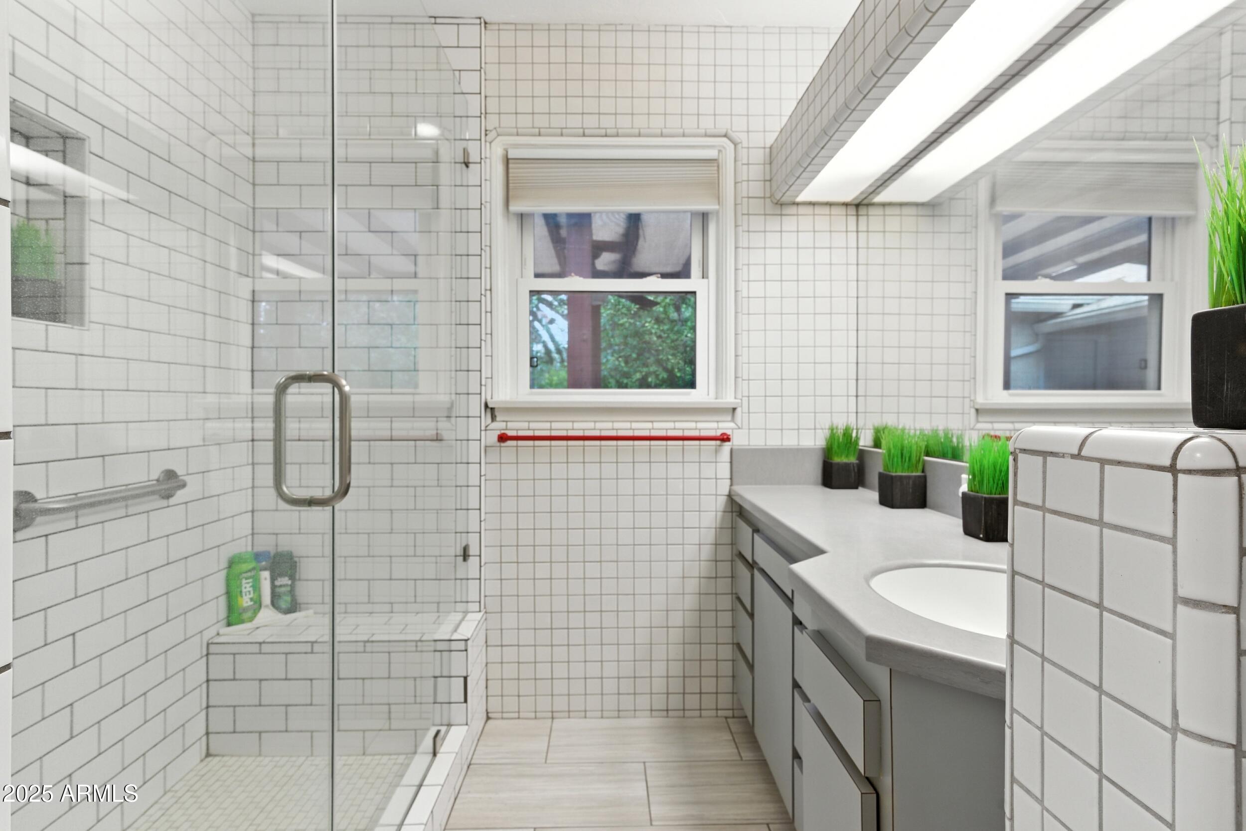 22 East 15th Street Tempe, AZ 85281 - Photo 53 of 84 a bathroom with a granite countertop sink a toilet and window