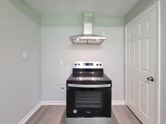 a room with a stove and a window