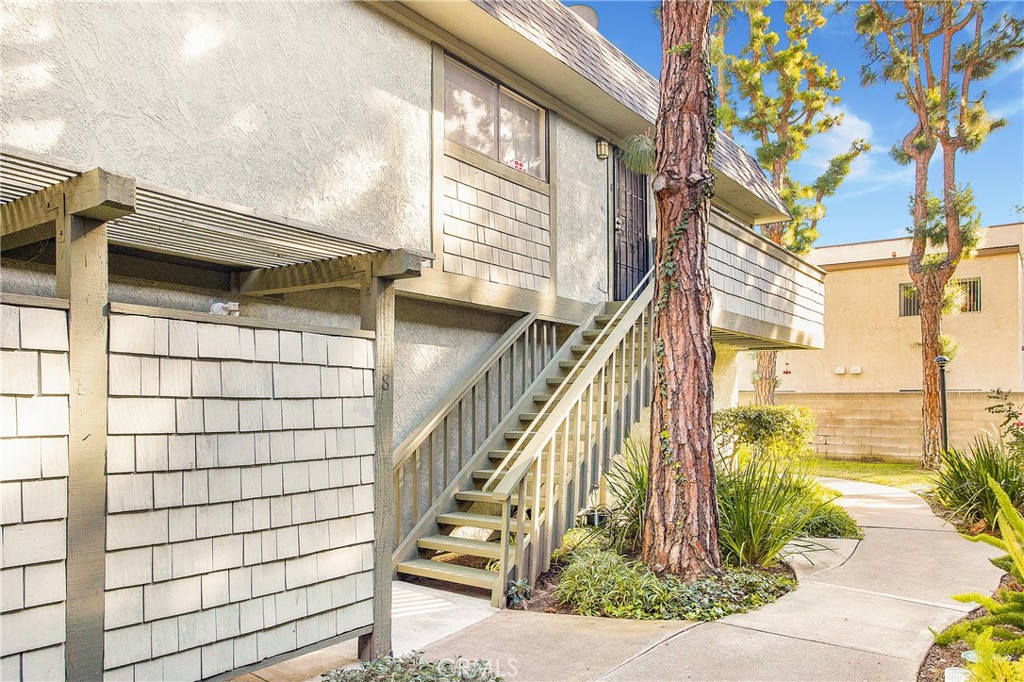 229 West Wilson Street, Unit 8 Costa Mesa, CA 92627 - Photo 1 of 11 a view of a pathway of a house