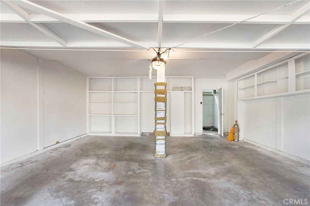 229 West Wilson Street, Unit 8 Costa Mesa, CA 92627 - Photo 2 of 11 a view of empty room with ceiling fan