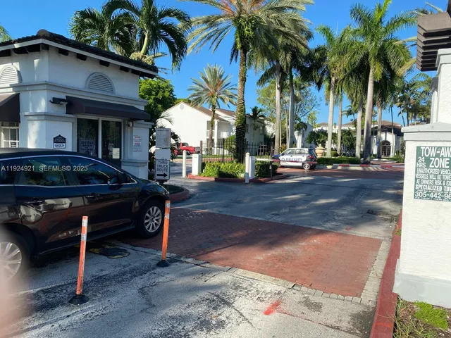 a backyard of a house with barbeque oven table and chairs