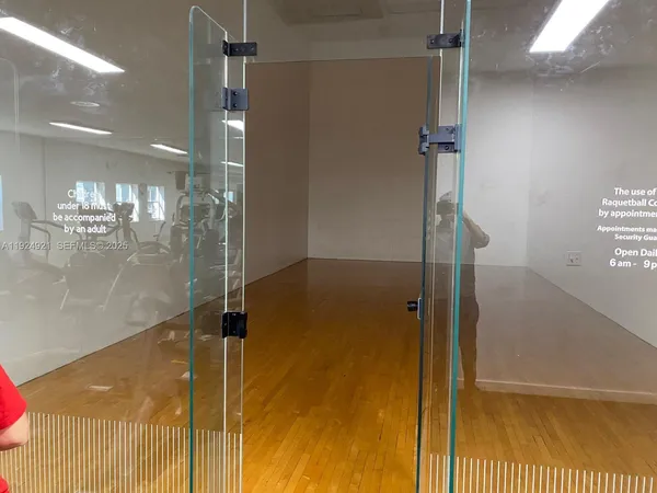 a bathroom with a glass shower door