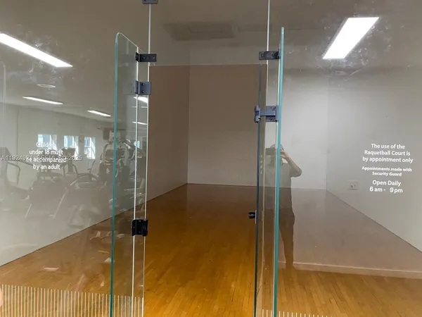 a bathroom with a glass shower door